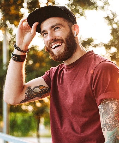 Man smiling after receiving dentistry for young adults